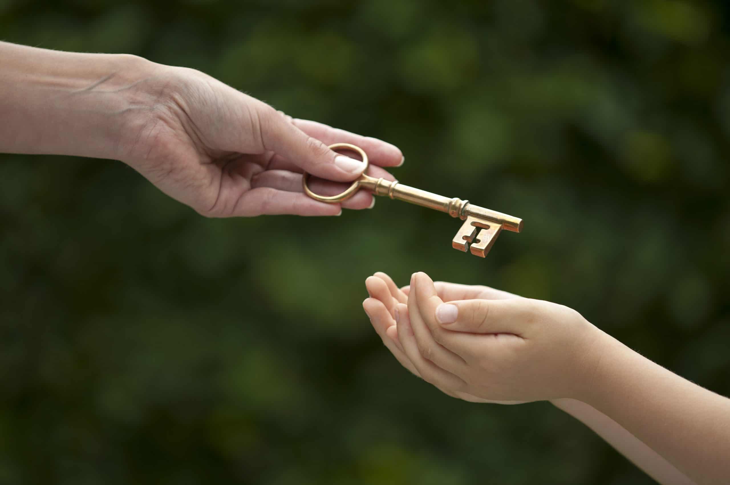adult hands key to child
