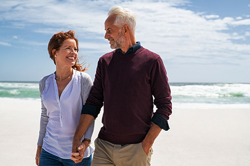 Senior couple on the beach - What are variable annuities?